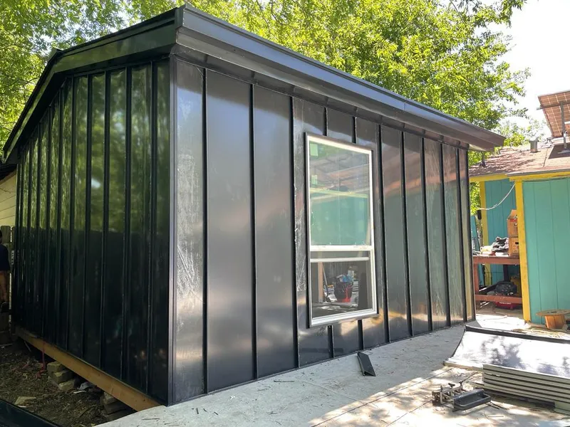 Black standing seam metal wall panels for Roof Inspection in Maltby